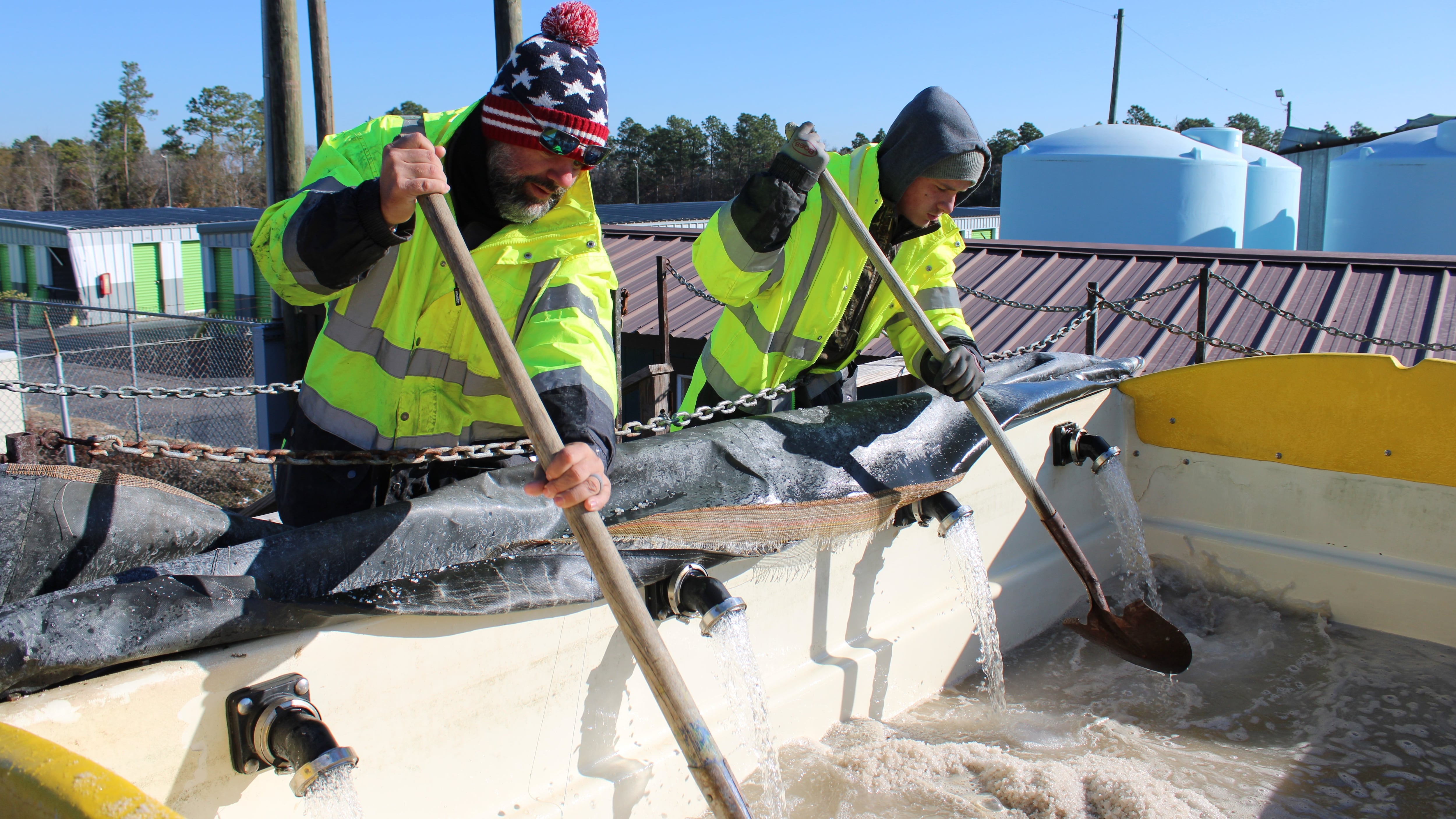 Crews mix a solution of salt and water to be applied to Georgia highways and bridges to help...