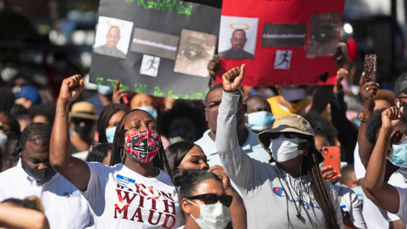 People react during a rally to protest the shooting of Ahmaud Arbery, Friday, May 8, 2020, in...