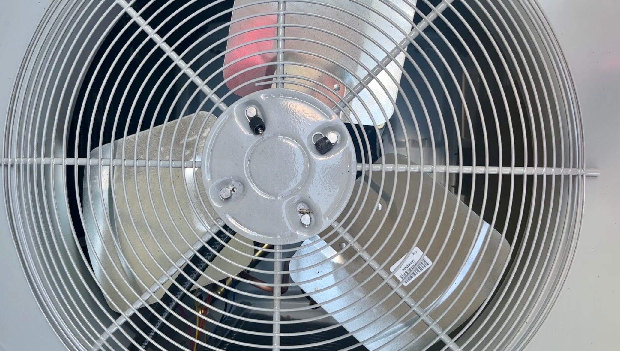 HVAC technician installs air conditioning unit in Nashville home ahead of extreme heat wave.