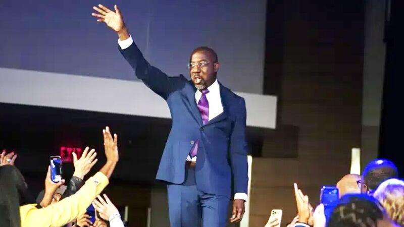 Democratic Sen. Raphael Warnock speaks during an election night watch party, Tuesday, Dec. 6,...