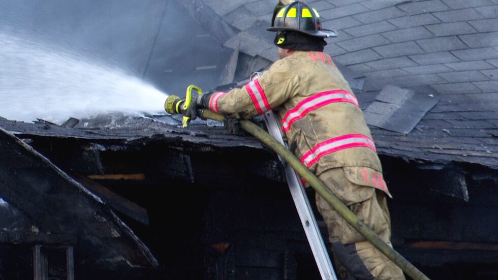 Crews work to extinguish a fire at a home on Independent Boulevard in Aiken County on Dec. 15,...