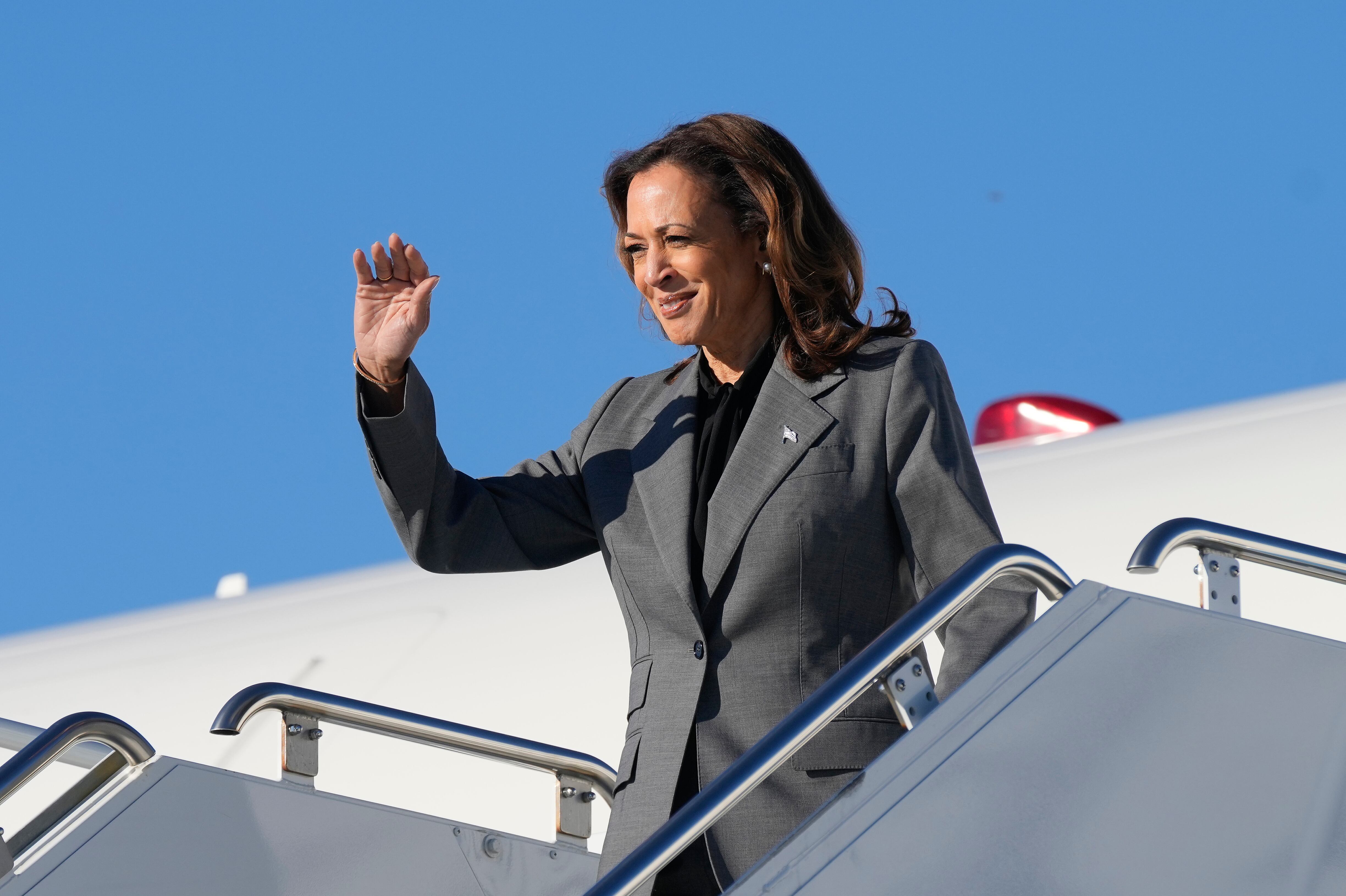 Democratic presidential nominee Vice President Kamala Harris waving during her arrival at Dane...