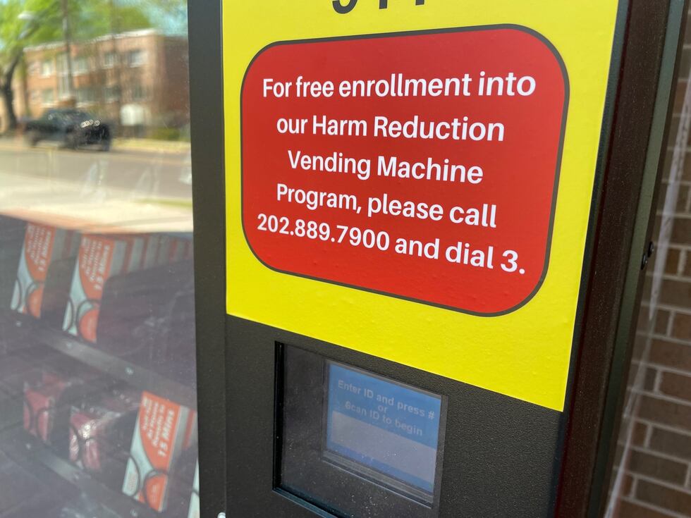 A photo of the front of a vending machine. The Sign on the machine reads "For free...