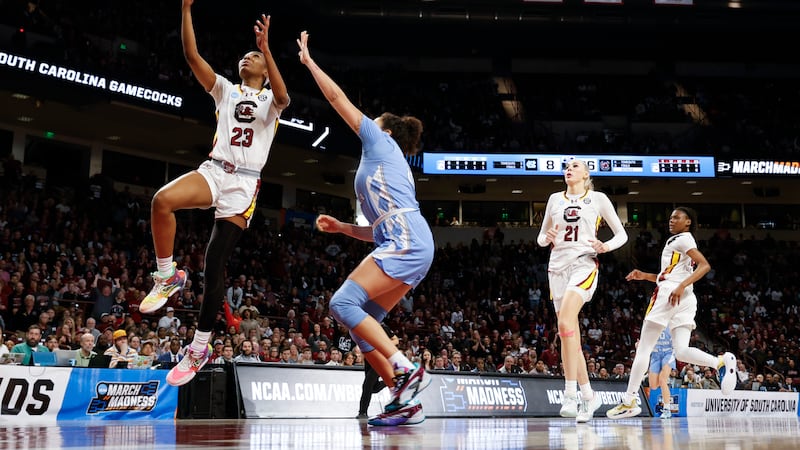 South Carolina guard Bree Hall (23) drives to the basket past North Carolina forward Alexandra...