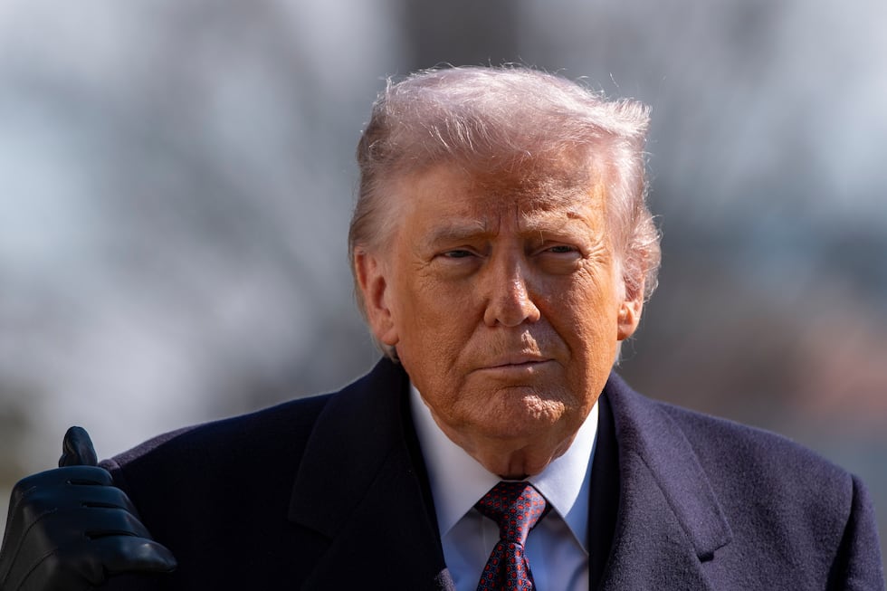 President Donald Trump walks to speak with reporters before departing on Marine One from the...