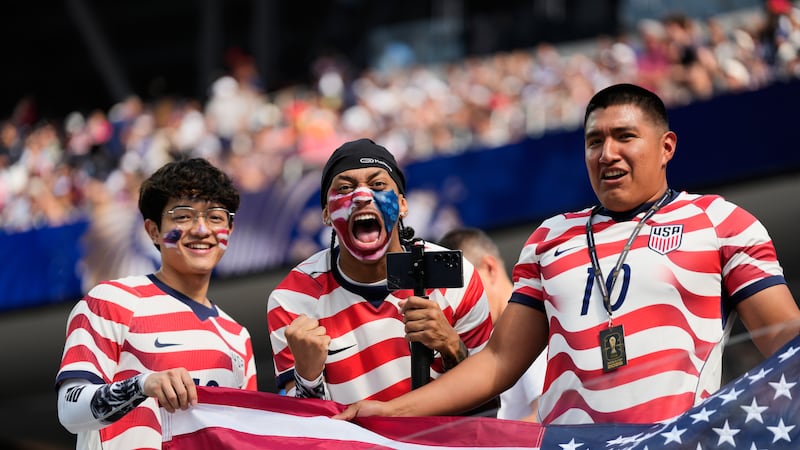 United States fans cheer prior to the World Cup Group D soccer match between the United States...