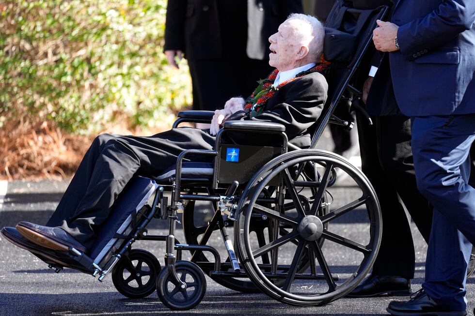 FILE - Former President Jimmy Carter departs after attending the funeral service for his wife,...