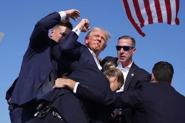 Republican presidential candidate former President Donald Trump is surround by U.S. Secret...