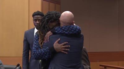 Shannon Stillwell hugs his attorney Max Schardt as verdicts are announced in the YSL trial.