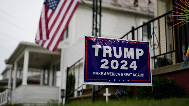 A sign ing president-elect Donald Trump is posted at a home in Zelienople,...