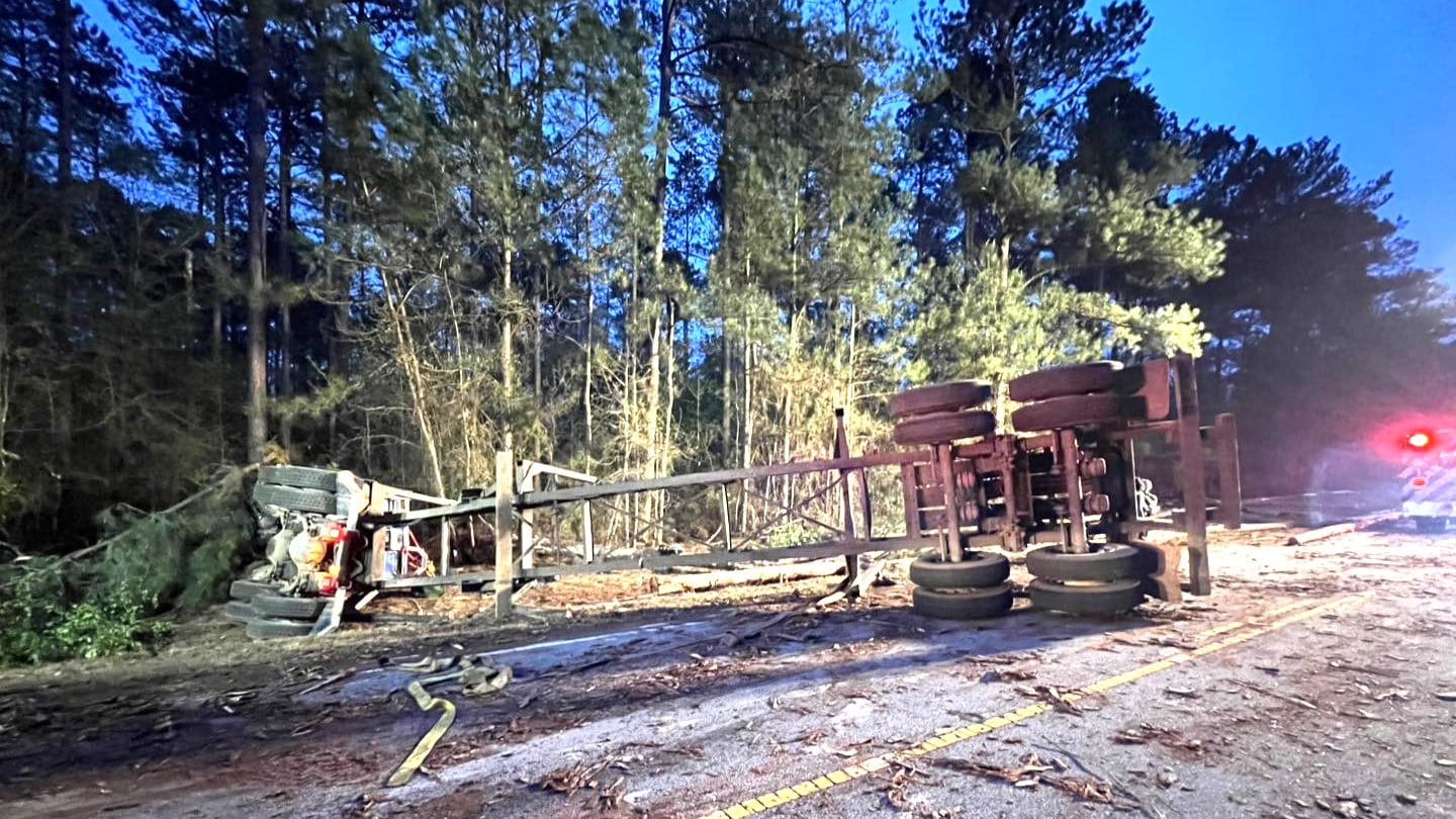 18-wheeler logging truck on Highway #28