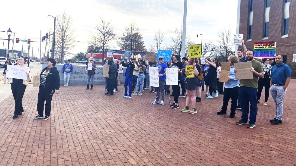 Protesters at the Augusta Judicial Center decry Donald Trump's policies on Feb. 5, 2025.