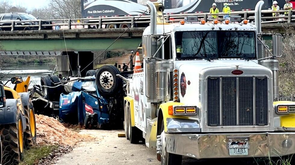 Crews from a local wrecker service had pulled the mangled remains of a big-rig from the...