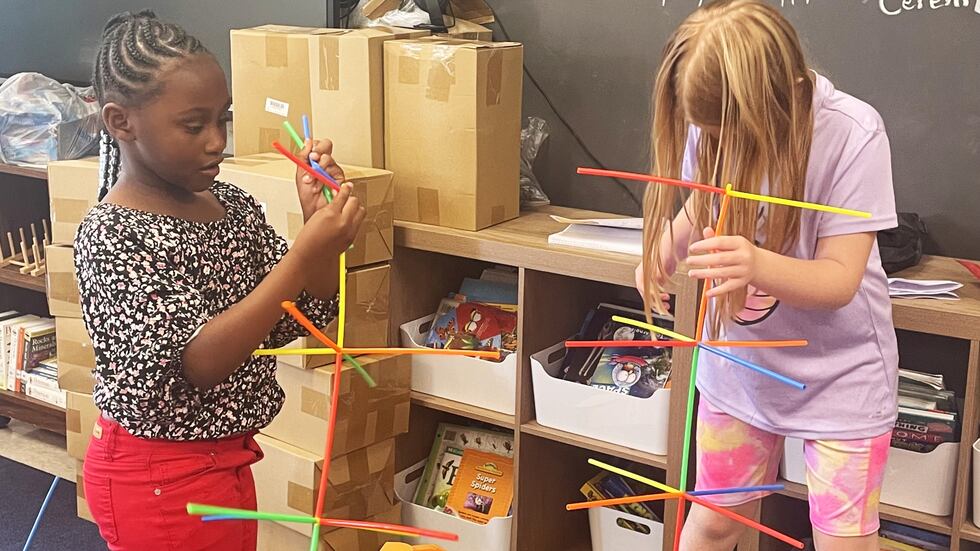 Students build a space center using building straws and connectors during last year’s...