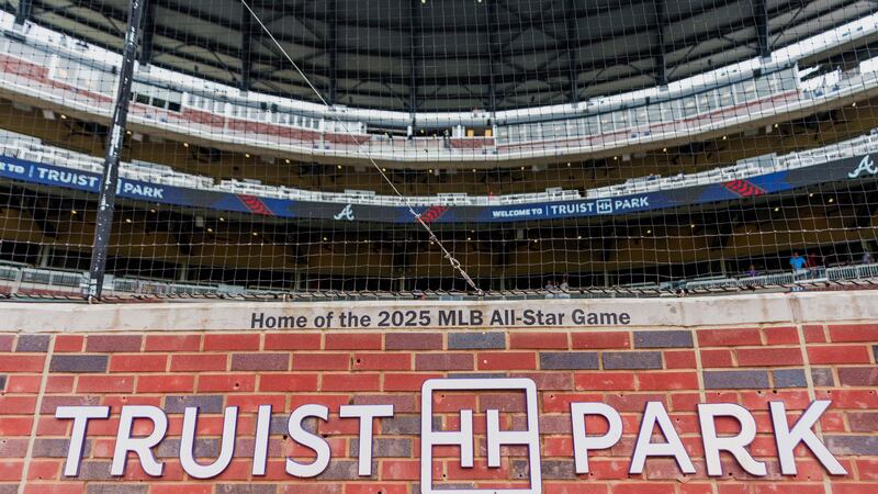 The wall behind home plate at Truist Park displays "Home of the 2025 MLB All-Star Game" before...