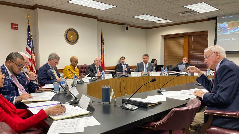 Georgia Senate Ethics Committee Chairman Max Burns, R-Sylvania, right, explains a bill that...