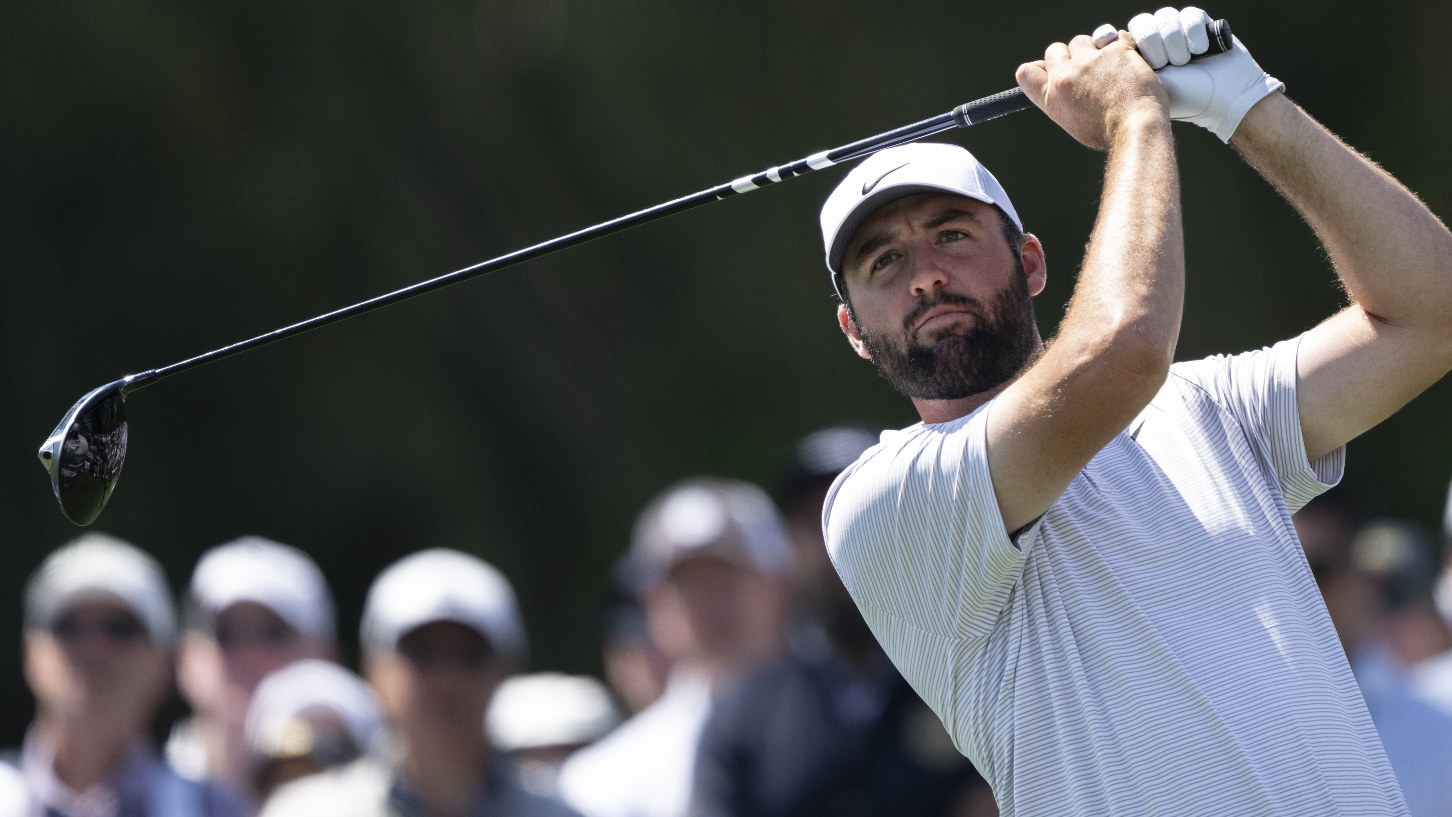 Masters champion Scottie Scheffler of the United States plays a stroke from the No. 17 tee...