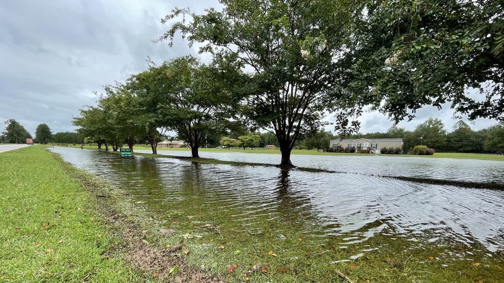 At a home along Buford's Bridge Highway, no one was there, but the yard and driveway were...