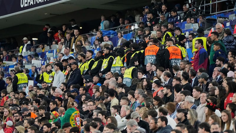 Match stewards form a line at the stands during the Nations League final soccer match between...