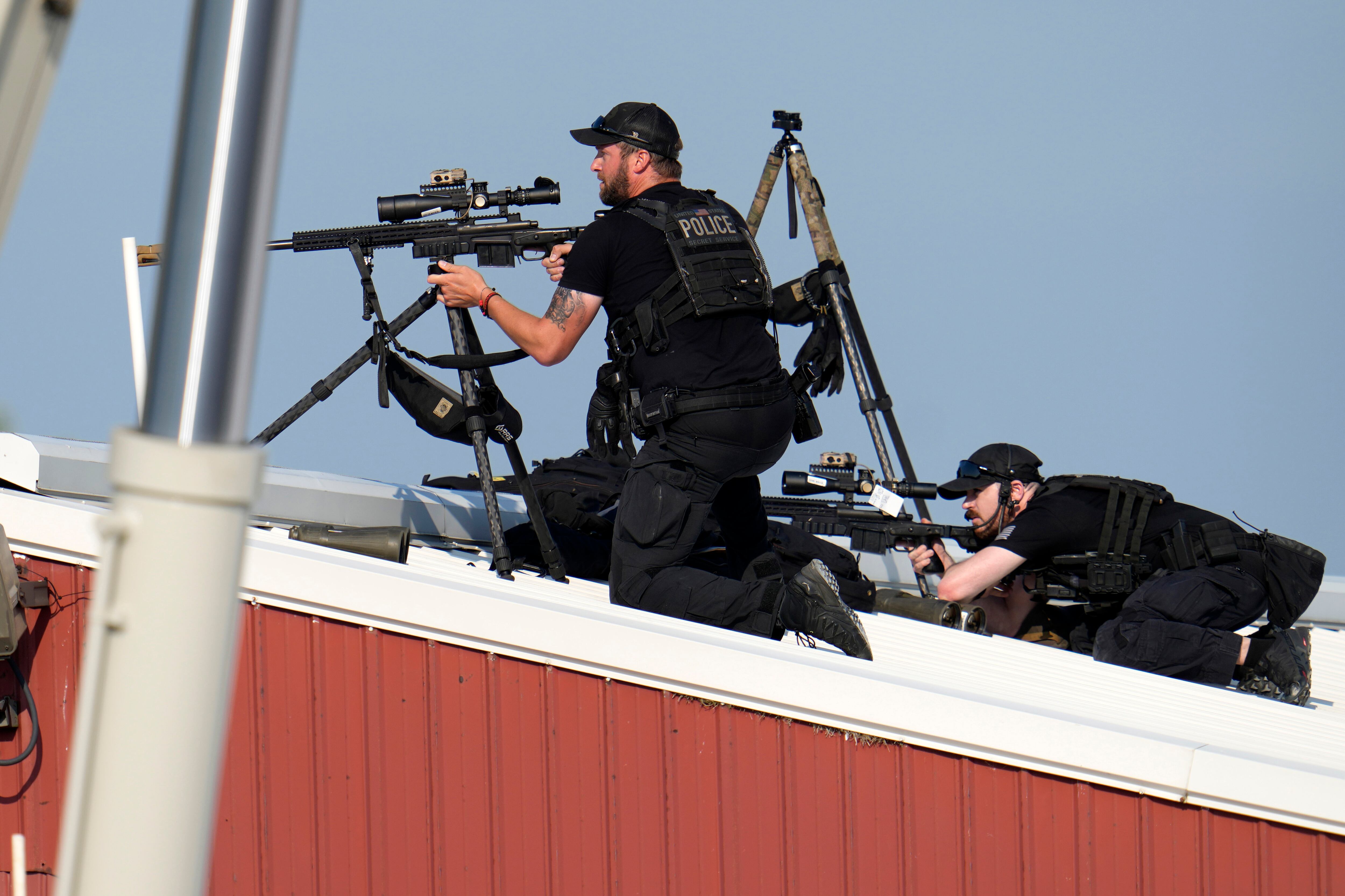 Police snipers return fire after shots were fired while Republican presidential candidate...