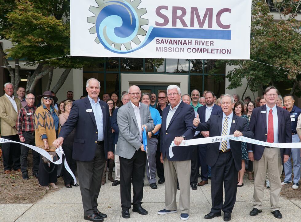 Holding the ribbon for the event, from left, are SRMC Chief istrative Officer Mark Barth,...