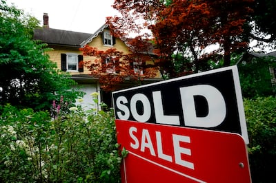 FILE - A sale sign stands outside a home in Wyndmoor, Pa., Wednesday, June 22, 2022. The...