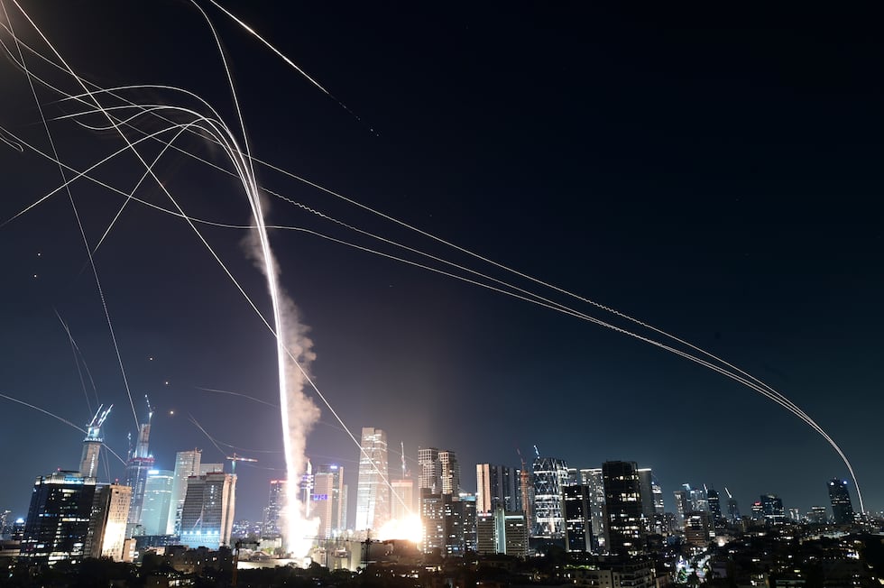 Israeli Iron Dome air defense system fires to intercept missiles over Tel Aviv, Israel,...