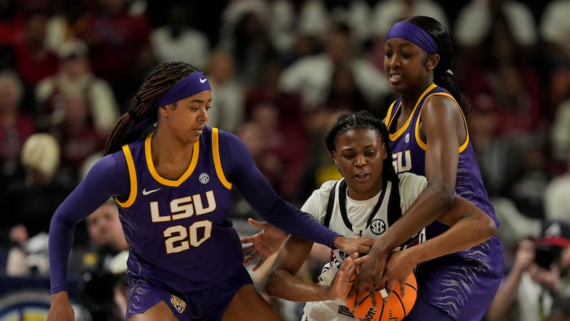 South Carolina guard MiLaysia Fulwiley vies for the ball with LSU guard Janae Kent, left, and...