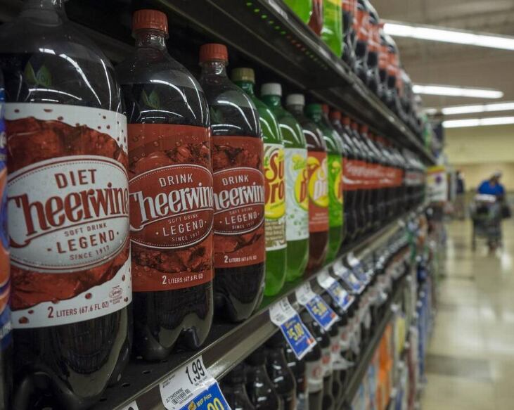 In this file photo, Cheerwine lines the shelves along with other soft drinks at the Food Lion...
