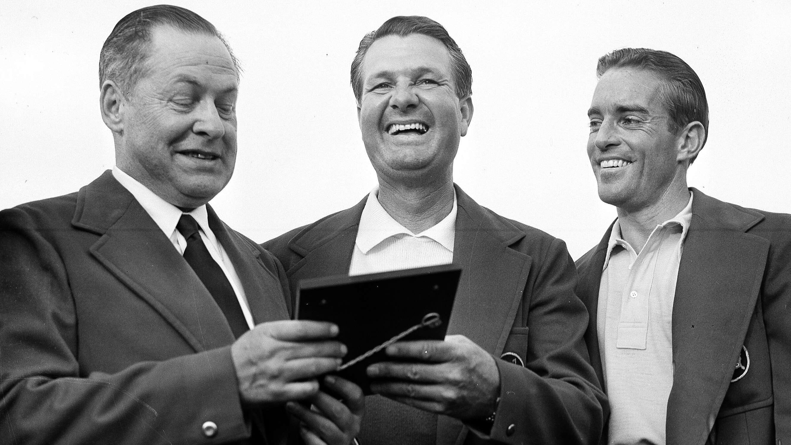 FILE - Bob Jones, president of Augusta National Golf Club, left, presents a plaque to Jimmy...