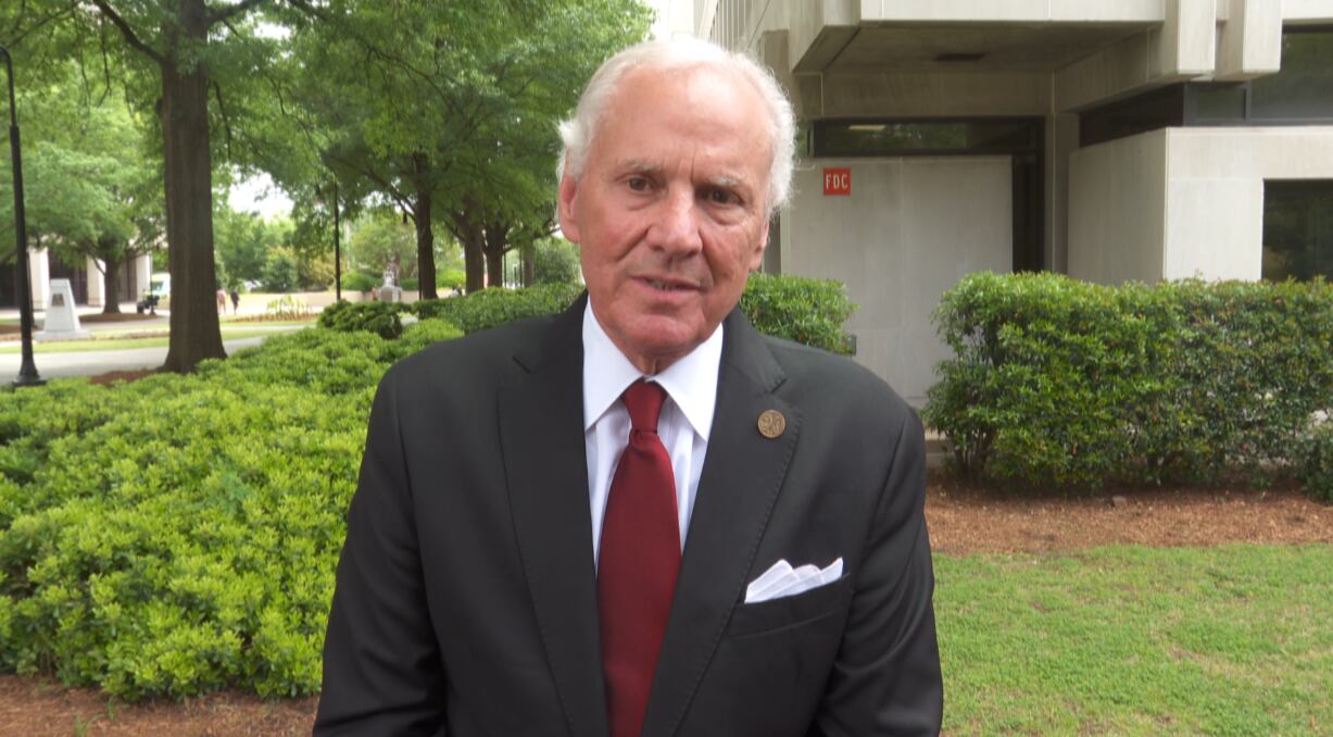 Gov. Henry McMaster speaks with reporters outside the South Carolina State House in Columbia...