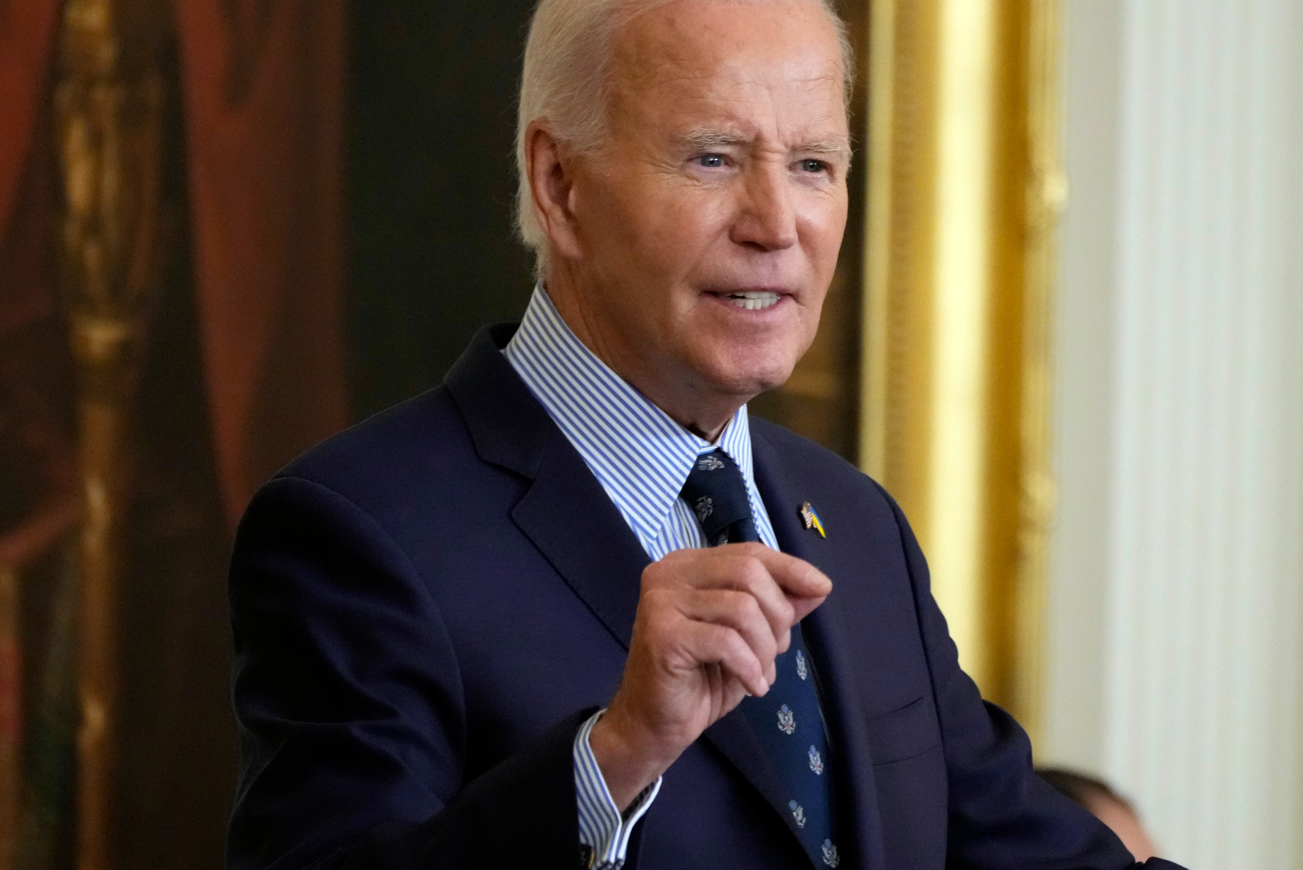 President Joe Biden speaks before g an executive order that aims to help schools create...