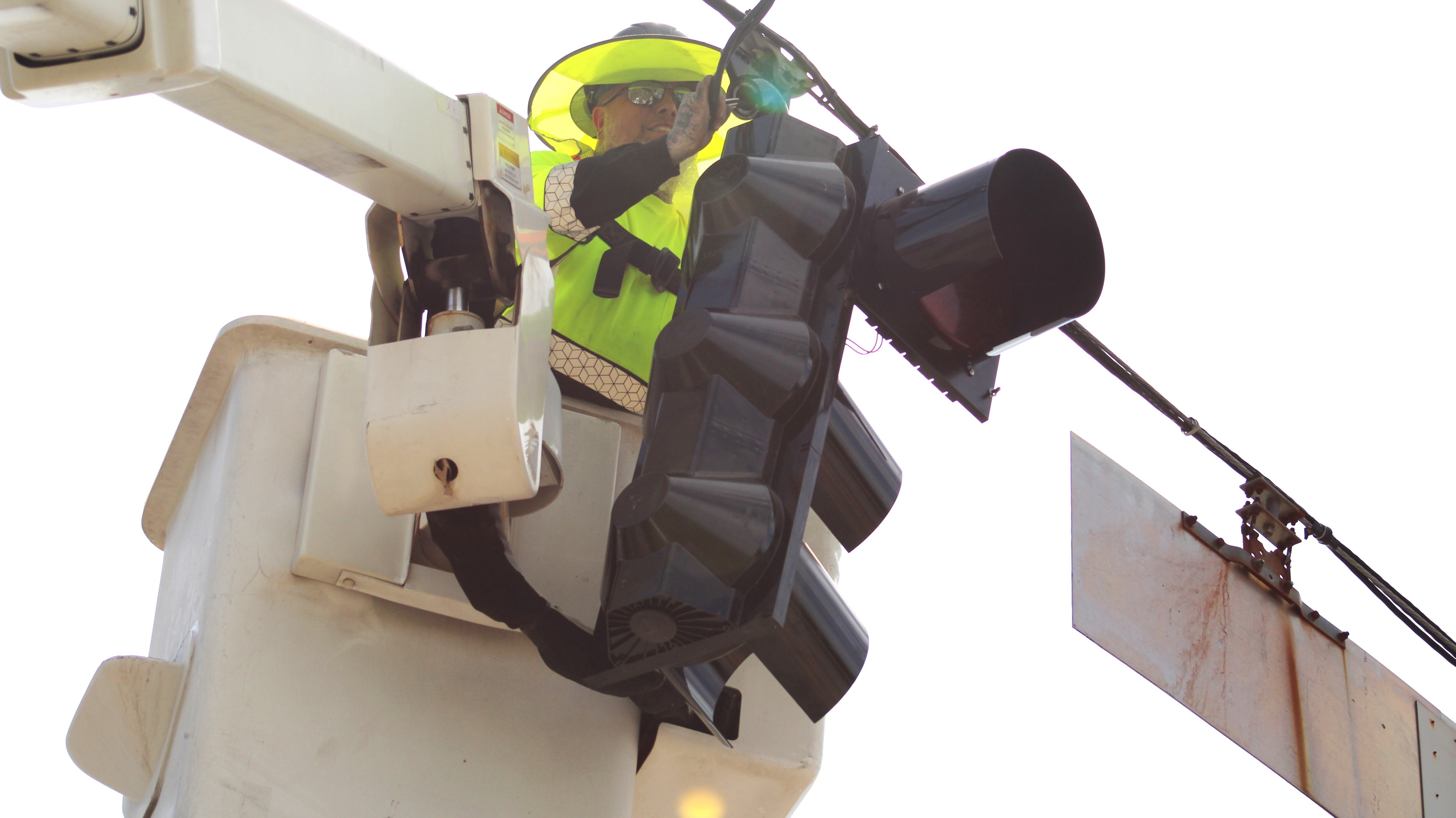 Repairs are made to a Richmond County traffic signal that was damaged by Hurricane Helene.