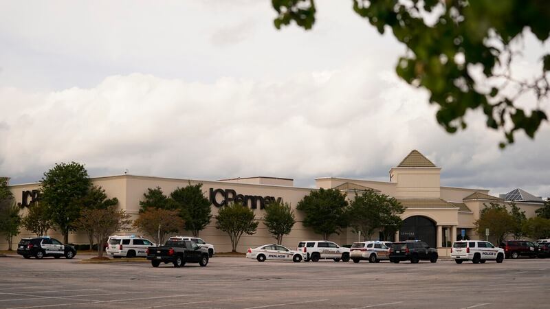Authorities stage in a parking lot at Columbiana Centre mall in Columbia, S.C., following a...