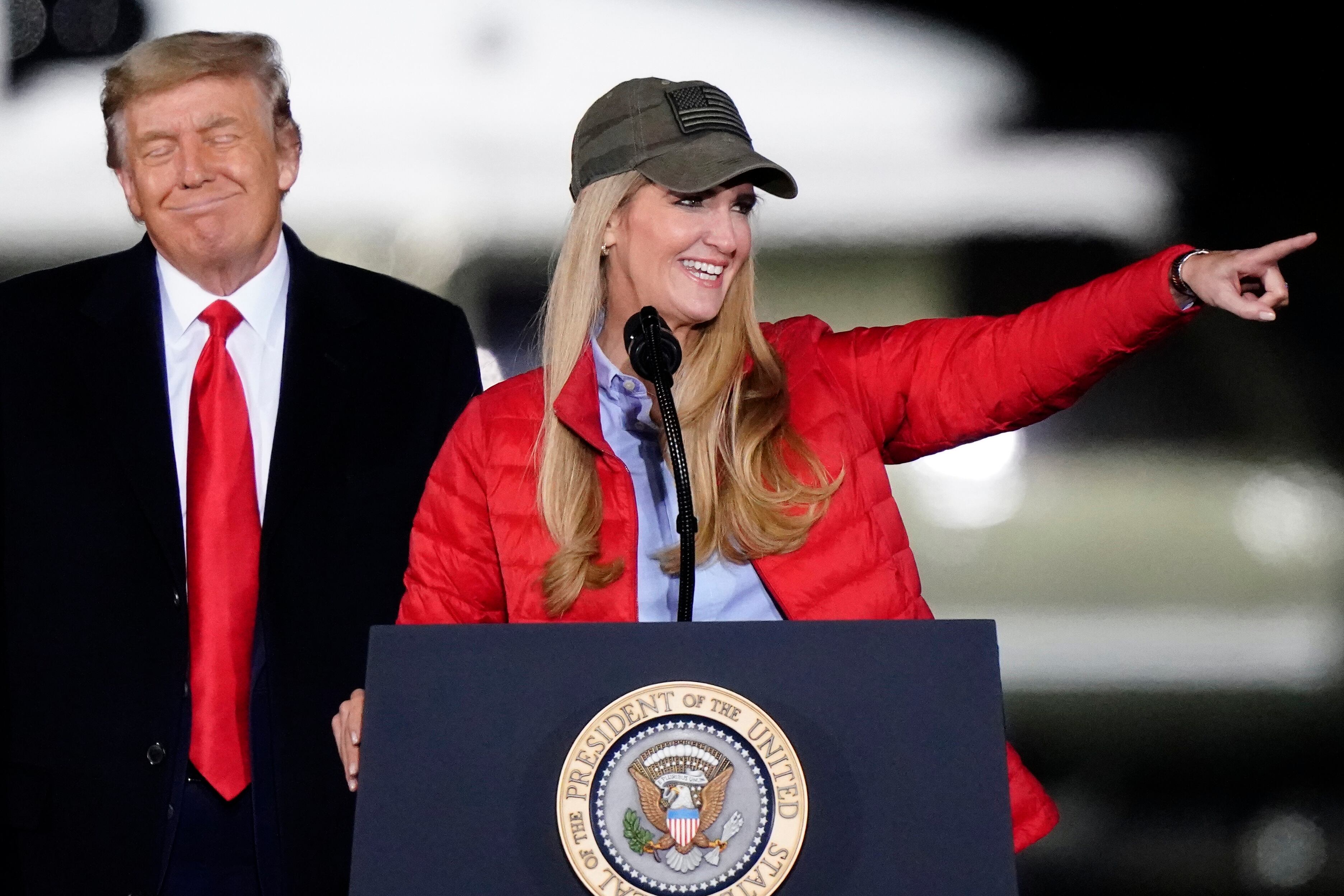 Sen. Kelly Loeffler, R-Ga., speaks as President Donald Trump listens during a campaign rally...