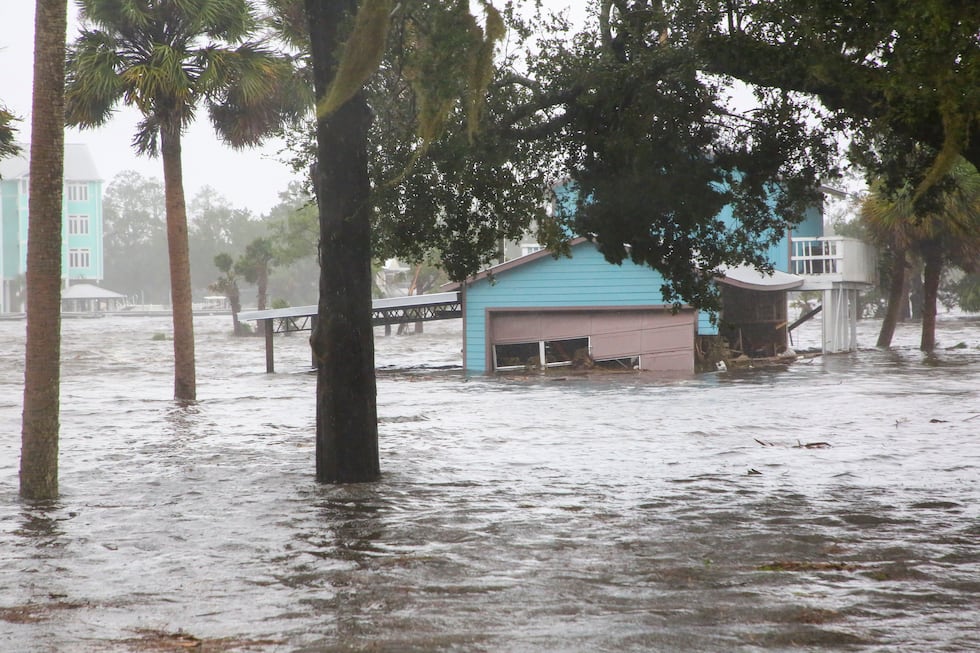 Storm surge floods a home off Riverside Drive on the Steinhatchee River in Steinhatchee, Fla.,...