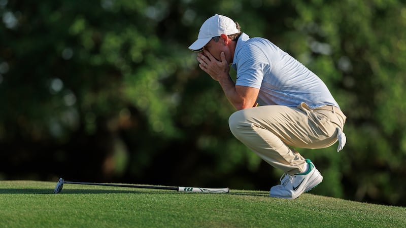 Masters champion Rory McIlroy of Northern Ireland before the final putt on the No. 18 green...