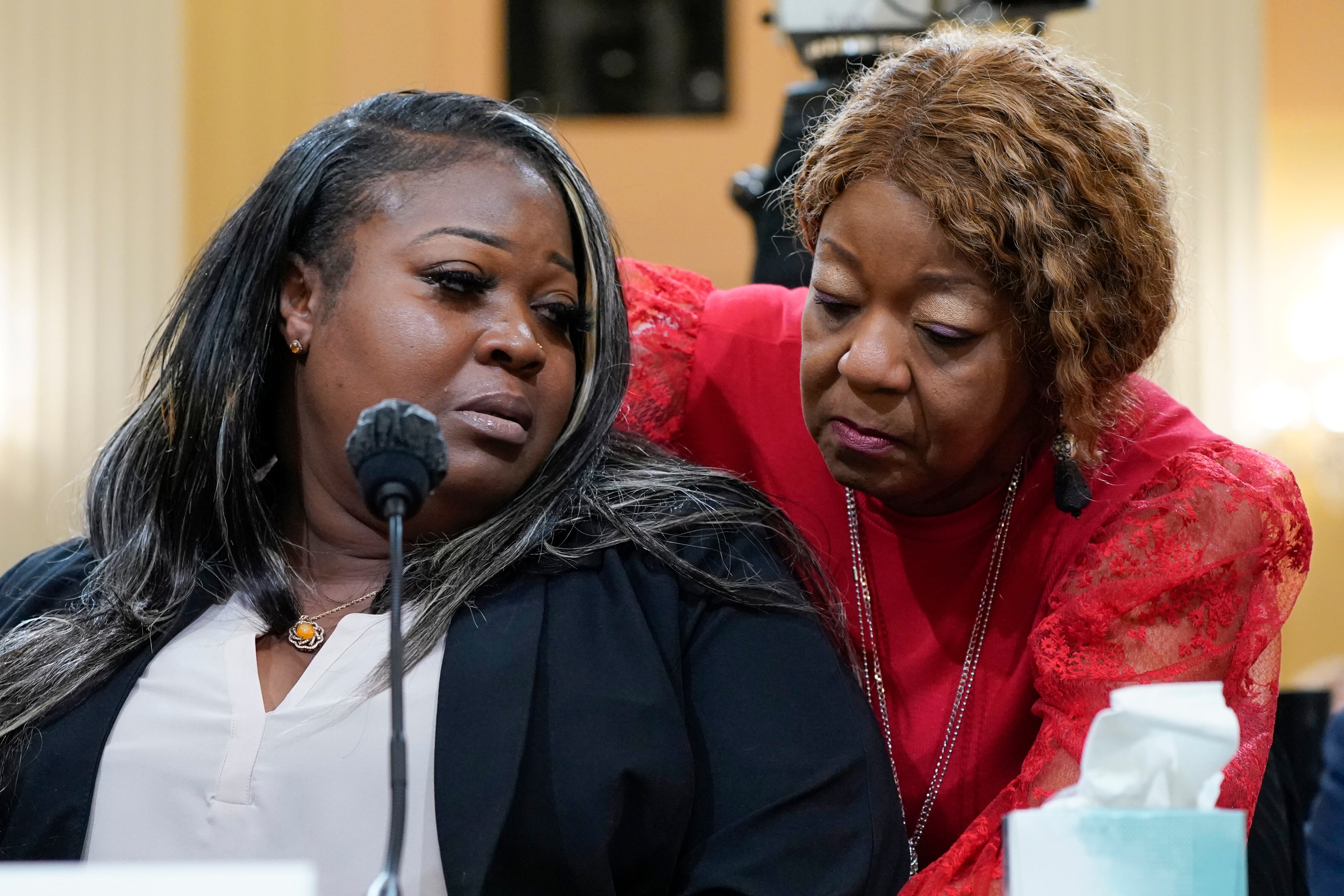 FILE - Wandrea "Shaye" Moss, a former Georgia election worker, is comforted by her mother Ruby...